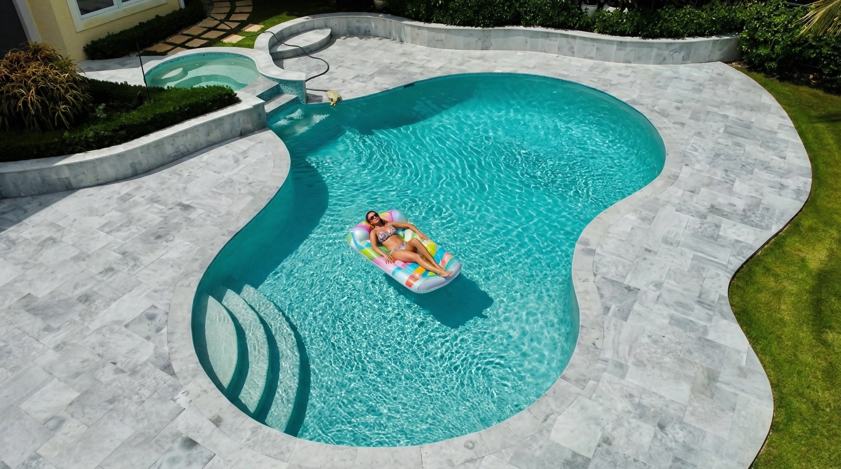 Freeform pool with spa and spillover